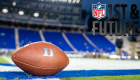A Duke football on the Duke football field with the NFL logo