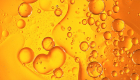orange circles and blobs within a liquid 