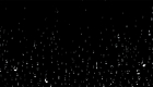 Water droplets cascading down a black background 