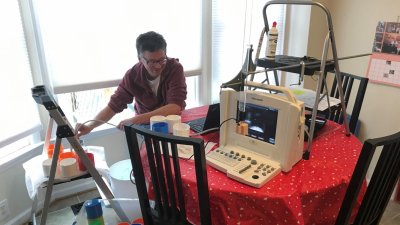 Matt Brown tests student projects with an at-home ultrasound