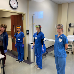 Nursing students demonstrate the face shields