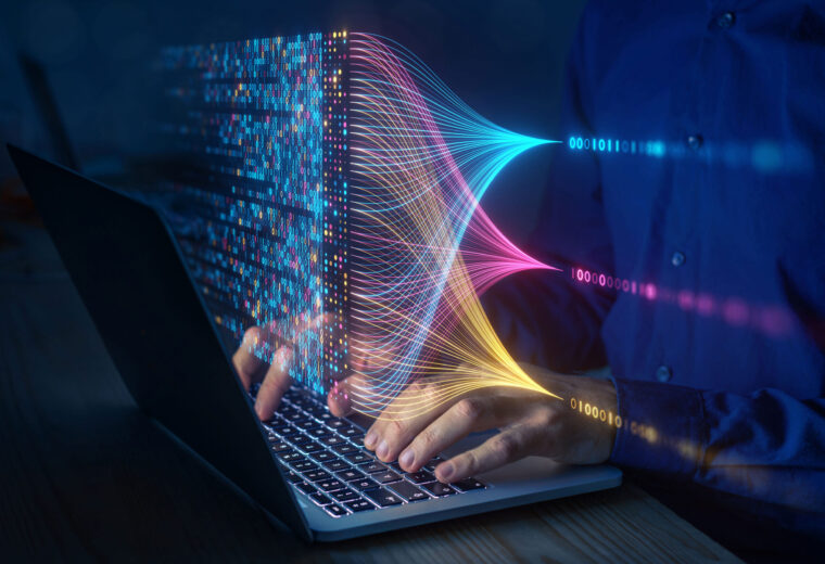 a figure types at a computer as different types of data are sorted in front of them