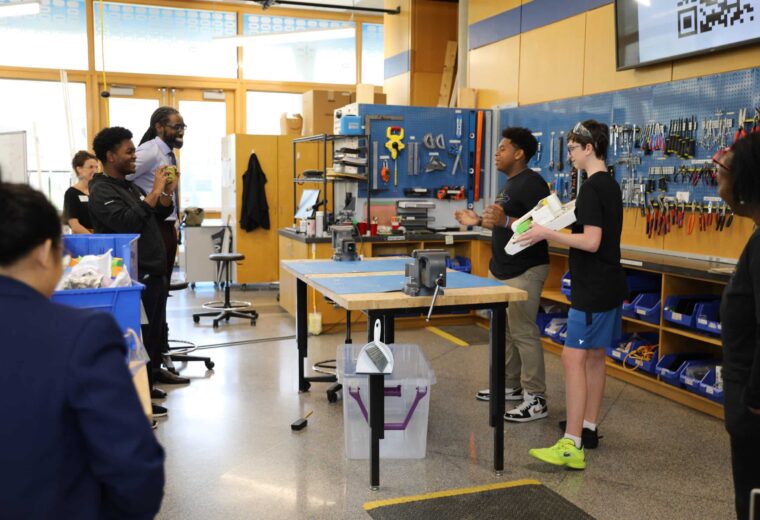 image of students and faculty in the design POD for a hackathon