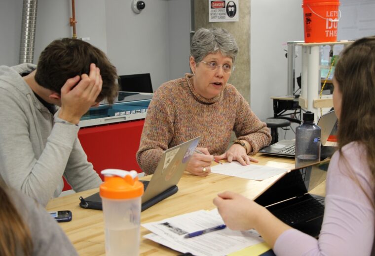 Ann Saterbak discusses a project with engineering students