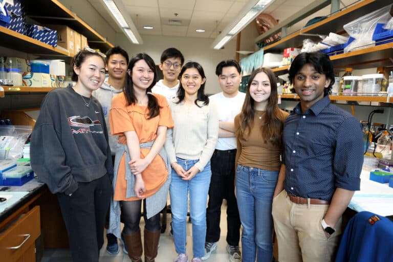 Pranam Chatterjee poses with his students in his lab