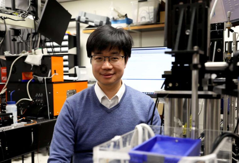 Junjie Yao poses in his lab