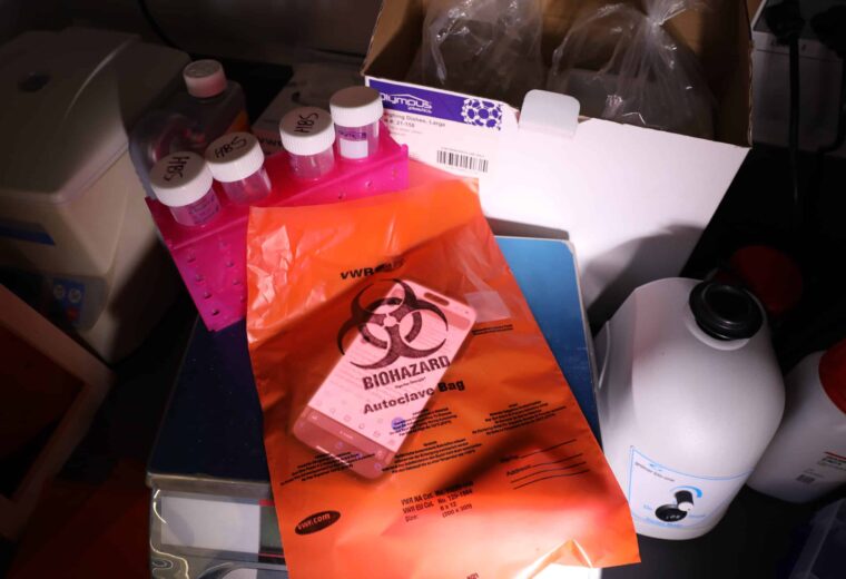 bottles and a bag with text biohazard