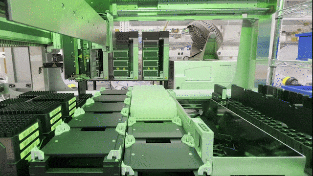 a repeating gif of robotic lab automation filling vials for biomedical research